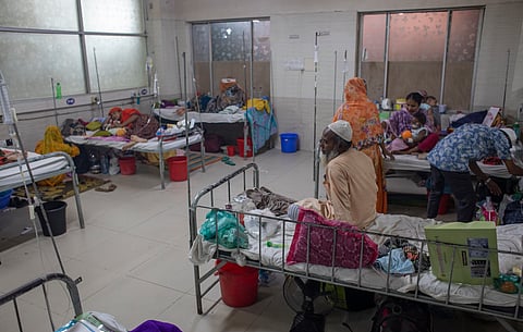 Families attend to their children affected by measles. The photo was taken at the Shishu Hospital in May 2026. 