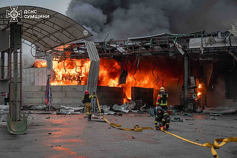In this photo provided by the Ukrainian Emergency Service, firefighters put out a fire in a gas station following a Russian air attack in Sumy, Ukraine, 25 June 2026.