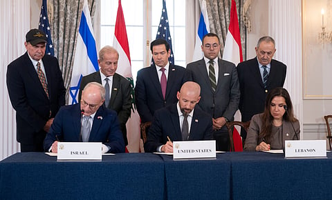 Secretary of State Marco Rubio and others watch, seated from left, Israel's Ambassador to the US Yechiel Leiter, counselor Dan Holler, and Lebanon's Ambassador to the US Nada Hamadeh, sign a framework agreement, described as a first step toward peace following months of conflict between Israel and the Lebanese militant group Hezbollah, at the State Department, 26 June 2026, in Washington.
