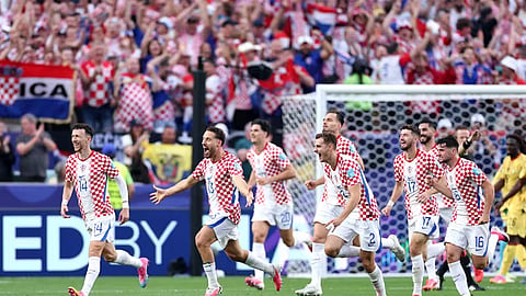 Croatia's Nikola Vlasic (c) celebrates with his teammates after scoring from a header against Ghana in their final Group I match of the FIFA World Cup 2026 on Sunday.