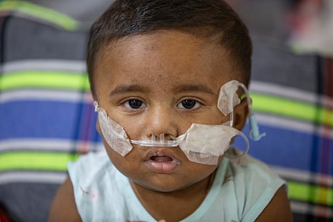 A child receives treatment for suspected measles at Shishu Hospital, Dhaka. 
