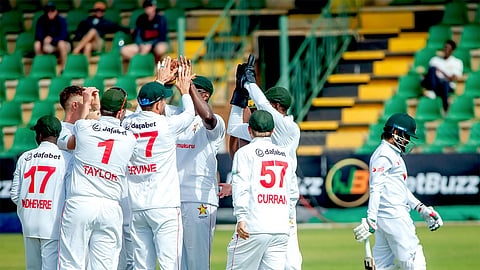 Zimbabwe players celebrate the wicket of Mahmudul Hasan Joy during the opening session of Day 1 of the one-off Test in Harare on Sunday.
