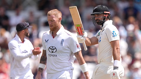 New Zealand's Daryl Mitchell, right, celebrates reaching a half century on day four of the Third Rothesay Test in Nottingham, England on Sunday