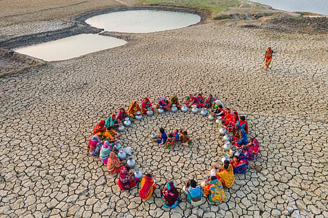 Women in Gabura, Satkhira take rest while collecting drinking water from distant areas