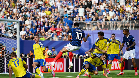 France's Kylian Mbappe scores the first of his two goals against Sweden in the Round of 32 match in New Jersey on Wednesday.