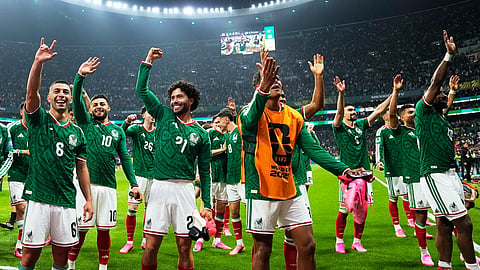 Mexico players celebrate following the World Cup Round of 32 match between Mexico and Ecuador in Mexico City on Tuesday
