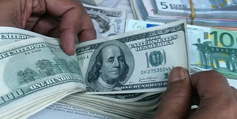 Representational image of counting dollars