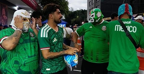 Mexicans wearing Lucha masks prepare to enter Arena Mexico in Mexico City, Friday, June 26, 2026.