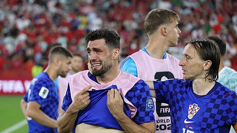 Croatia's Sucic cries as Luka Modric consoles him after their elimination from the World Cup following a 2-1 defeat to Portugal in the Round of 32.