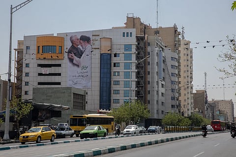 A poster showing Major Gen. Qassem Soleimani kissing Ayatollah Mojtaba Khamenei’s forehead in Tehran