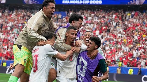 Morocco's Azzedine Ounahi, center, is congratulated by teammates after scoring his side's 2nd goal against Canada during the World Cup round of 16 match in Houston on Saturday