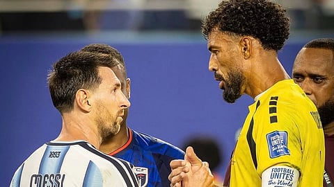 Argentina's Lionel Messi (L) and Cape Verde's Vozinha. 