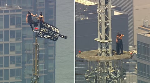 A Russian couple unfurled on top of the Empire State Building on Wednesday.