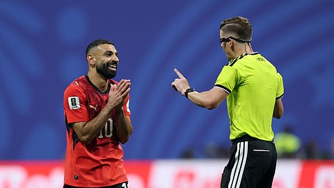 Egypt's Mohamed Salah reacts at referee Francois Letexier