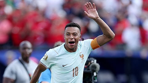 France's Kylian Mbappe celebrates after the match as France qualify for the semi final stage of the World Cup