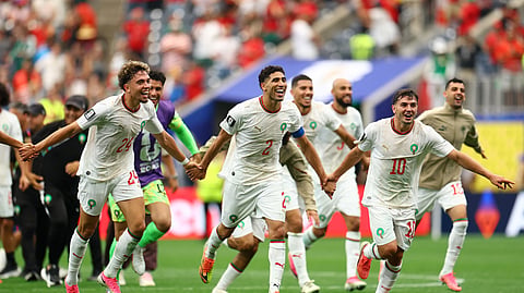 Morocco's Achraf Hakimi, Brahim Diaz and Neil El Aynaoui celebrate after the match