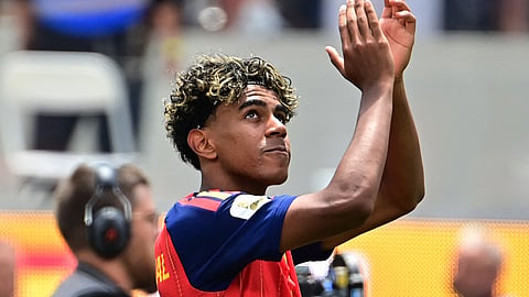 Spain's Lamine Yamal celebrates after the match as Spain qualify for the semi final stage of the World Cup