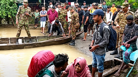 Tourists left Sajek on Friday morning after Army personnel helped them cross flooded stretches by boat
