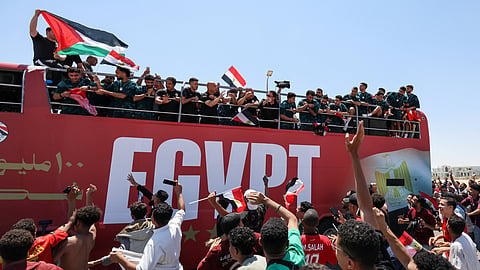 Egypt's national soccer team ride on a bus as they are welcomed by fans at El Alamein International Airport upon their return from the 2026 FIFA World Cup, ahead of an official reception by President Abdel Fattah al-Sisi, in El Dabaa, Egypt, July 10, 2026.