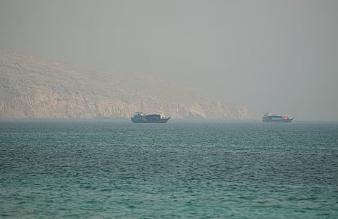 Caption: Vessels at the Strait of Hormuz, as seen from Musandam, Oman, July 9, 2026. 