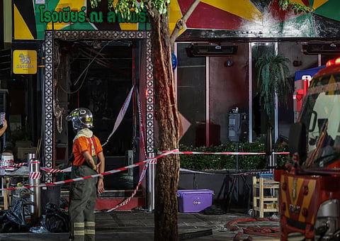 At least 27 people were killed and dozens more injured after a devastating fire ripped through a popular pub in Bangkok