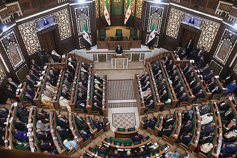 Syrian President Ahmad al-Sharaa addresses the inaugural session of Syria's newly formed People's Assembly, the first since the fall of President Bashar Assad's government, in Damascus, Syria, 12 July 2026. 