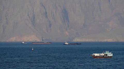 Ships and tankers in the Strait of Hormuz off the coast of Musandam, Oman, 18 April 2026.