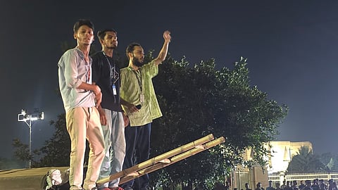 Protesters return to Manik Mia Avenue in the capital after being dispersed by police earlier.