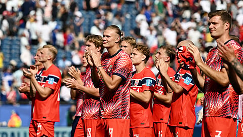 Norway's Erling Haaland, Kristian Thorstvedt, Andreas Schjelderup and Alexander Sorloth applaud fans after their group stage match against France
