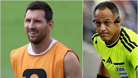 Lionel Messi (L) and referee Ismail Elfath. 