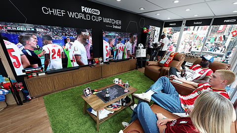 Chief World Cup Watchers Kevin Akoto and Austin Franklin watch the England v Argentina FIFA World Cup Semi Final match in their World Cup Watcher Box located in Times Square