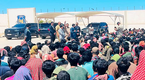 Bangladeshi migrants gather at the Bangladesh Embassy in Libya ahead of their repatriation.