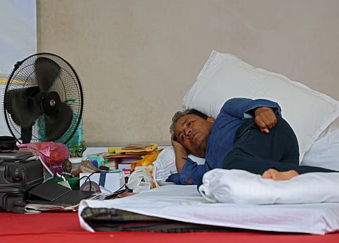 Sonam Wangchuk, an Indian education reformer, who has been on hunger strike, rests on stage during a sit-in protest called by CJP demanding the resignation of Indian Education Minister Dharmendra Pradhan, at Jantar Mantar in New Delhi, India, July 13, 2026.