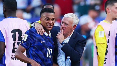 France coach Didier Deschamps and France's Kylian Mbappe celebrate after the match against Paraguay as France qualify for the quarterfinal stage of the World Cup in Philadelphia on July 4.