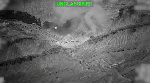 Smoke rises from an explosion at an unknown location, during what US Central Command (CENTCOM) says are strikes on Iran, in this screen grab taken from a handout video released on July 18, 2026.