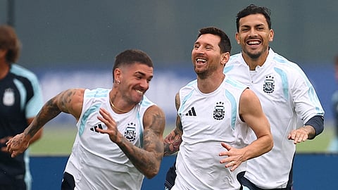 Argentina's Rodrigo De Paul, Lionel Messi and Leandro Paredes during training