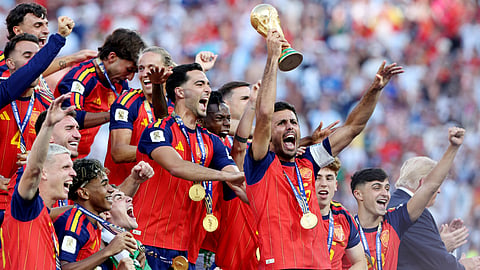 Spain's Rodri lifts the World Cup trophy alongside teammates as they celebrate winning the World Cup