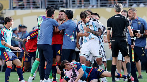 Argentina's Leandro Paredes clashes with Spain's Gavi as Argentina coach Lionel Scaloni and coaching staff clash with Spain's Eric Garcia after the final in New Jersey on Monday