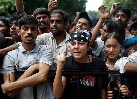 Supporters of India's Cockroach Janta Party (CJP) react at a protest site, a day after thousands of protesters marched toward parliament demanding the resignation of Education Minister Dharmendra Pradhan over examination paper leaks, at Jantar Mantar in New Delhi, India, July 21, 2026. 