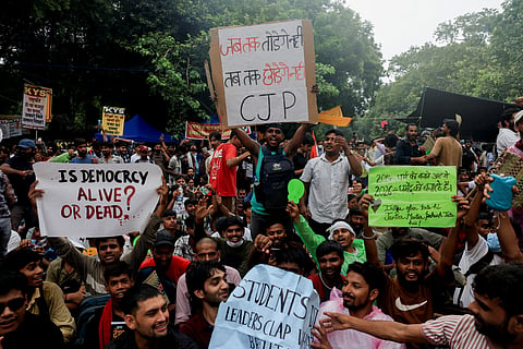 Supporters of India's Cockroach Janata Party (CJP) hold placards and chant slogans during an ongoing protest at Jantar Mantar in New Delhi, India, July 24, 2026.