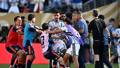 Argentina's Leandro Paredes and Lisandro Martinez clash with Spain's Gavi after the World Cup final
