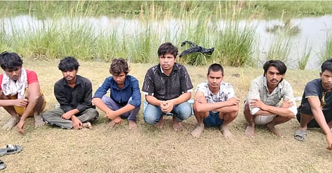 The seven individuals who were allegedly being pushed into Bangladesh are seen near the zero line at the Charaldanga border in Chapainawabganj.