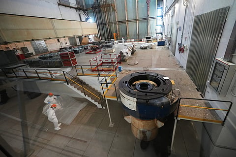 Workers package reactor components on the reactor operating floor of the former nuclear power plant of Latina, Italy, Thursday, June 18, 2026.