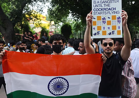 Cockroach Janta Party (CJP) supporters celebrate after the resignation of Education Minister Dharmendra Pradhan over National Eligibility cum Entrance Test (NEET) examination paper leaks, at Jantar Mantar in New Delhi, India July 25, 2026. 