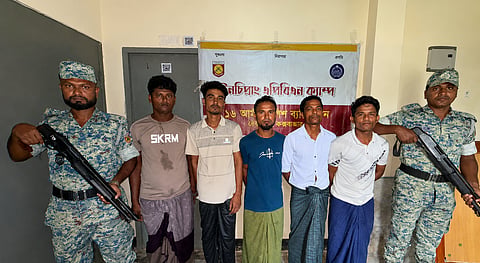Five Rohingya men inside the camp