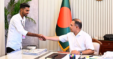Prime Minister Tarique Rahman shakes hands with Sheikh Azizur Rahman, a survivor of the July 2024 mass uprising, at the Prime Minister's Office on Thursday.