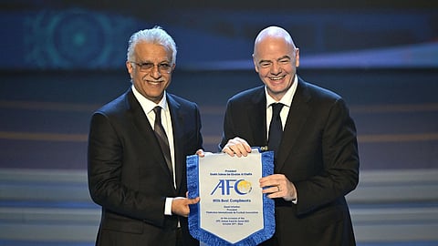 AFC president Sheikh Salman bin Ebrahim Al-Khalifa (L), FIFA president Gianni Infantino