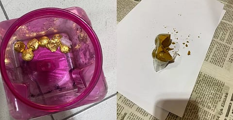 During a body search, officials recovered capsule-shaped packets containing gold.
