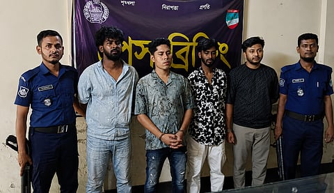 Police escort alleged Chattogram crime kingpin Mobarak Hossain Emon, alias David Emon, following his arrest in Jashore on Wednesday during a raid.