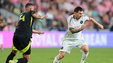 Inter Miami CF forward Lionel Messi (10) dribbles the ball against Columbus Crew defender Rudy Camacho (4) during the second half at Nu Stadium